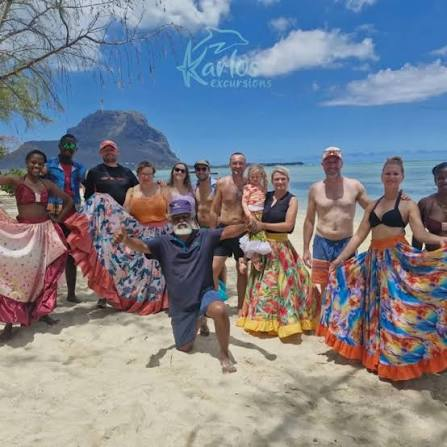 Guests and sega dancers on the beach at Le Morne